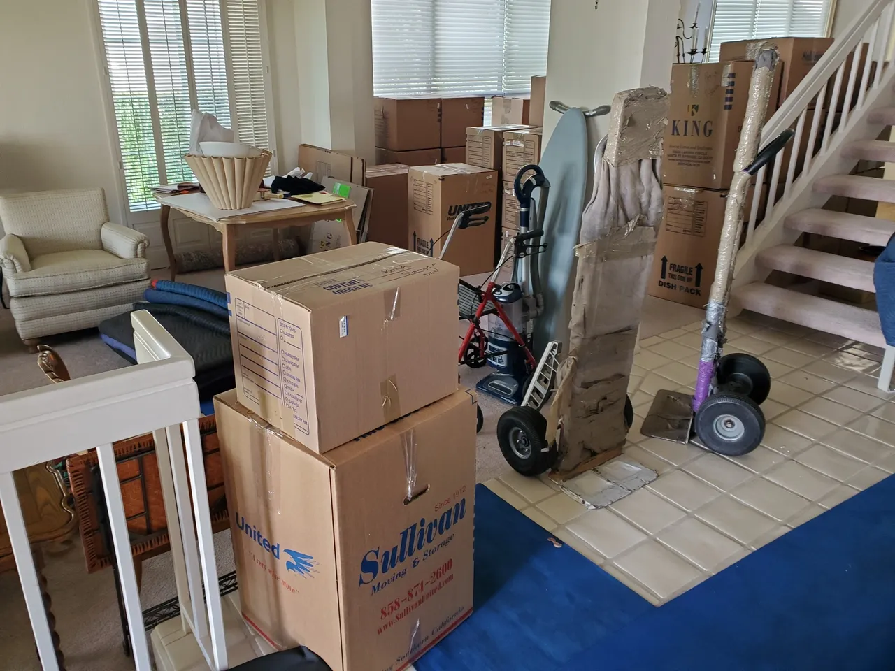 Boxes and furniture in a living room.